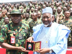 The Commandant, Armed Forces Command and Staff College (AFCSC), presenting a plaque to the Minister of Defence, Muhammad Badaru on Tuesday in Kaduna