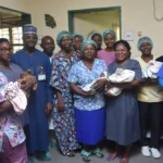 The CMD, National Hospital, Prof. Muhammad Mahmud, the parents of the sextuplets, Mr Ifeanyi and Mrs Precious Nwachukwu and hospital staff with the sextuplets, on Thursday in Abuja
