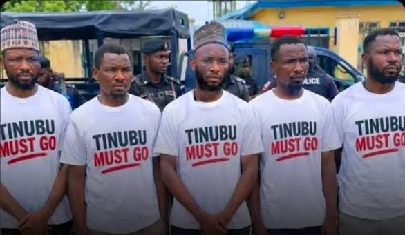 Police arrest men for wearing Tinubu must go shirt